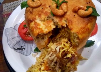 আস্ত একটা কেক আর তা কাটলেই চমক! কেকের ভেতর থেকে বেরিয়ে আসছে সেই জিভে জল আনা বিরিয়ানি!