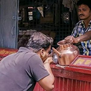 Daily News Reel - Shop Owner Feeding Water to Passers-by